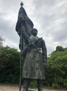 This is a communist statue that can now be found in Momento Park in Hungary which is home to all of the other statues from that era. They have been removed from the cities and placed into a monument park for historical reference