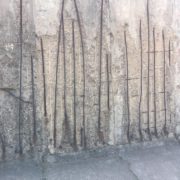 The cracks within the Berlin Wall.