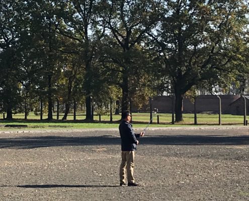 A Visitor Takes a Selfie at Auschwitz-Birkenau