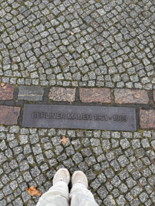 Line marking where the Berlin Wall once stood, dividing Berin into East and West Germany. After attempting to file for victim payments after the war, Stella was recognized by other Jews for her role as a greifer. She was arrested and served ten years in a Soviet labor prison, after which she moved to West Germany to live out the rest of her life. Photo credit: Sarah Vallejo